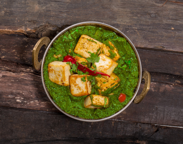 indian-punjabi-cuisine-palak-paneer-made-up-spinach-cottage-cheese-decorative-kadhai_57665-25